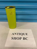 Green Waterford tube standing upright next to identification sign