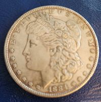 Obverse of 1884 Morgan dollar showing Liberty head, date, legend