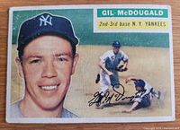 Front of 1956 Topps Gil McDougald card showing player portrait and action image