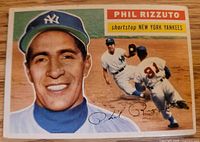 Front of 1956 Topps Phil Rizzuto card showing imagery and autograph facsimile