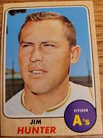 Front of card showing player portrait, team, position, year design