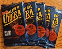 Five sealed 1992-93 Fleer Ultra hockey card foil packs displayed side by side
