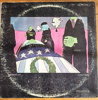 Front jacket with artwork, visible ring wear