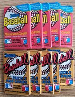 Front view of ten sealed Donruss Baseball wax packs, five red 1988 and five gold 1987.