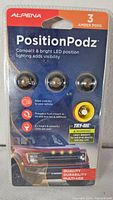 Front of sealed Alpena PositionPodz pack showing three amber pods and product details