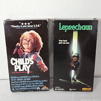 Front view of both VHS slipcases showing titles and artwork