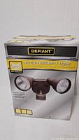 Box front showing Defiant motion security light product image and branding