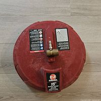 Top view of EZ Clean 15" red surface cleaner, quick-connect fitting visible