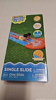 Front of sealed box showing product image, brand, length 16 ft, age rating 3+, single slide