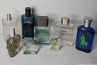 Group shot of all eight fragrance bottles