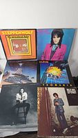 Six LPs including Steppenwolf 16 Greatest Hits, Joan Jett LP, guitar-spacecraft LP, Def Leppard Pyromania, unknown male vocalist LP, Billy Joel 52nd Street