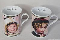 Front view of both Shirley Temple mugs showing primary portraits and handles