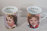 Front view of both mugs showing Shirley Temple portraits