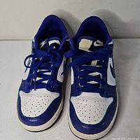 Front view of both sneakers showing toe boxes, laces, and colorway