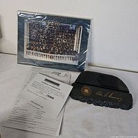 Complete set showing photo, audio base, COA, and instructions