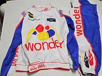 Jacket and pants laid out showing overall design and logos