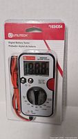 Front view of Utilitech Digital Battery Tester in sealed package