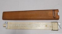 Full view of slide rule and leather case