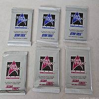 All six sealed packs front view