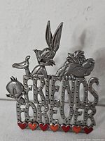 Front view showing characters, text and heart accents