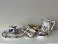 Group shot showing all eleven china pieces