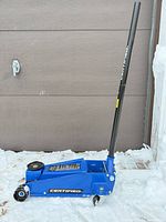 Full view of Certified 3 ton floor jack with handle assembled