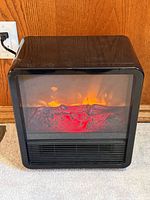 Front view showing glass window, flame effect and vents