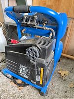 Full view of Mastercraft twin-stack air compressor showing tanks, motor housing and handle