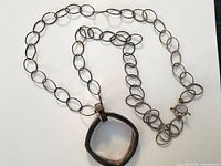 Full view of sterling silver necklace and pendant