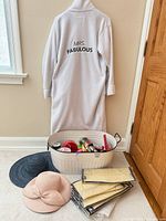 Full lot showing robe, enamel tub with contents, hats and clear bags