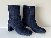 Side view of both suede ankle boots