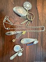 Overview of four steampunk jewellery pieces on wood surface