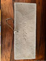 Top view showing suede exterior and embossed Pandora logo