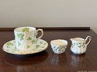 Group shot: teacup on saucer, sugar bowl, creamer