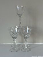 All five crystal wine glasses stacked and grouped