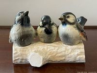 Front view of Goebel three sparrows on log figurine