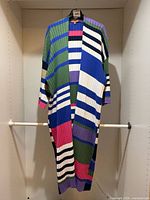 Full view of the striped long cardigan hanging