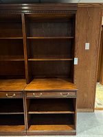 Front view of bookcase showing shelves and drawer