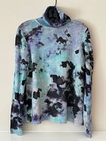 Full front view of sweater showing pattern and style