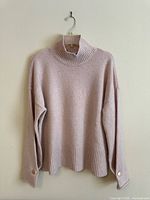 Front view of the cashmere turtleneck sweater
