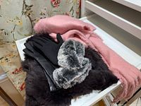 Black leather gloves, pink scarf, grey faux-fur neck warmer, black faux-fur scarf grouped