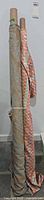 Two fabric bolts standing on end showing patterns