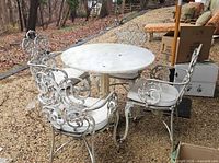 Full patio set showing table and four chairs