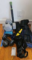 Group shot showing roller, dumbbells, ankle weights, resistance band, gait belt, back brace