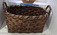 Overall view of rectangular wooden basket front and interior