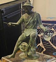 Front view of bronze Neapolitan Fisherman statue on acrylic stand