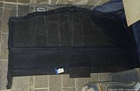 Full view of dark painted French cane king headboard