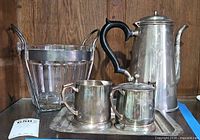 Front view showing crystal ice bucket, coffee pot, creamer, sugar bowl and tray