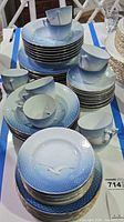 Stacks of Seagull pattern plates and cups