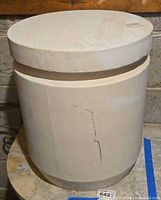 Front view of ceramic pedestal showing cylindrical shape and flat top